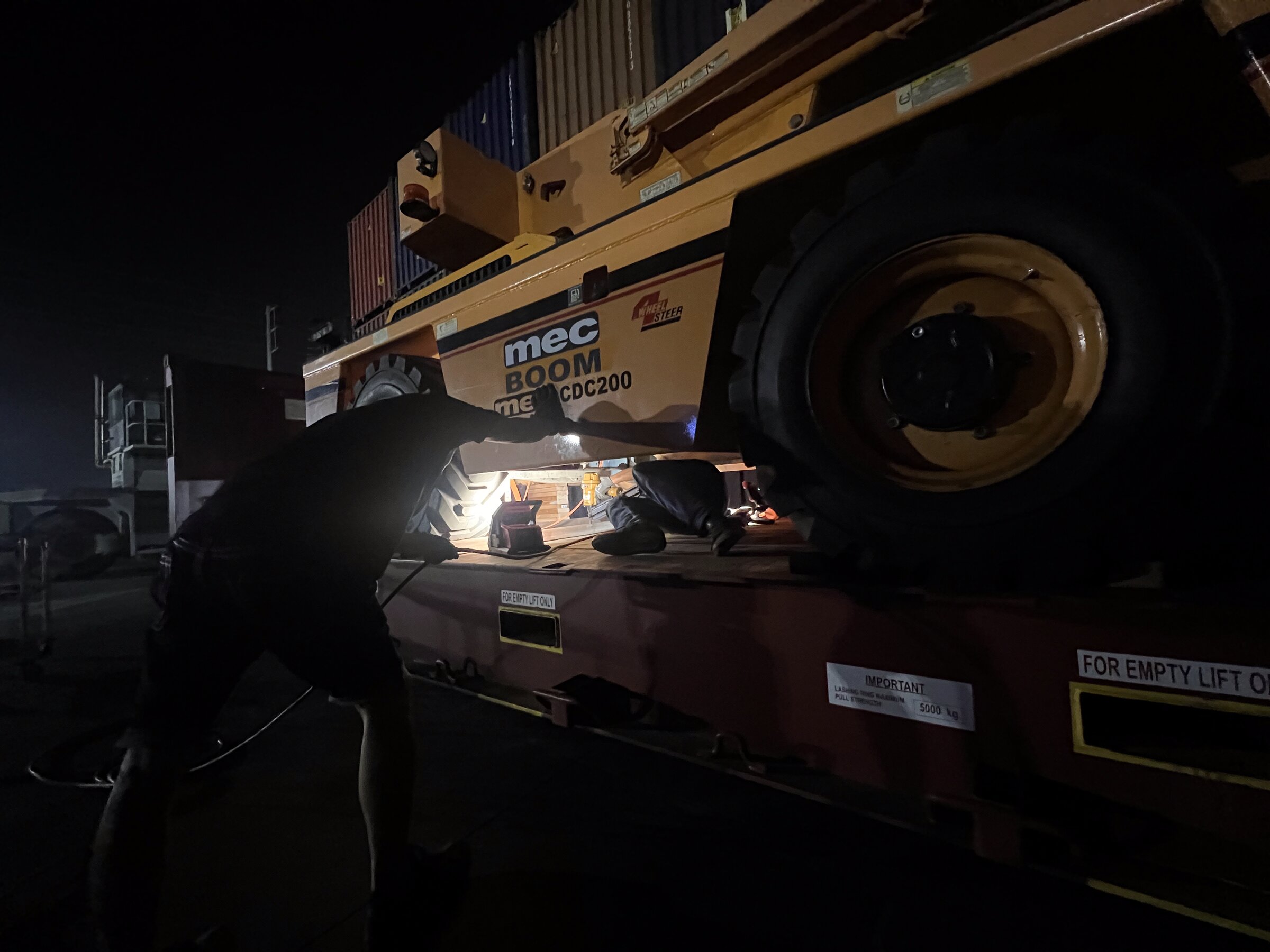 Volvo truck with wrapped industrial cargo on flatbed